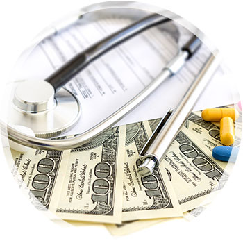 medical bills, money and a stethescope